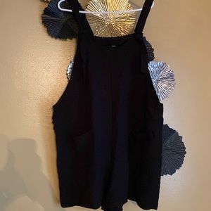 Black front pocket romper.